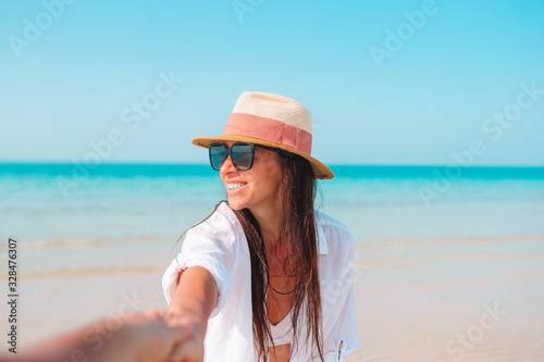 Wallpaper Mural Woman laying on the beach enjoying summer holidays looking at the sea Torontodigital.ca