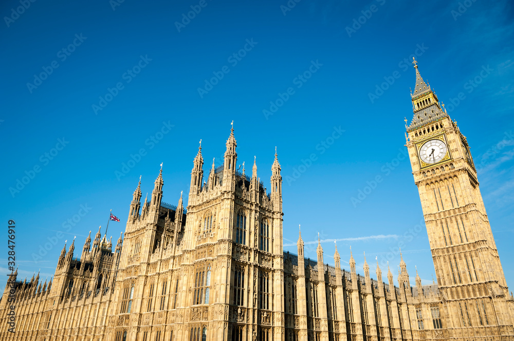 Bright blue sky morning view of the Houses of Parliament at Westminster in London, UK 