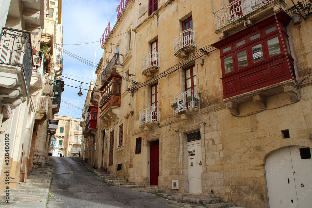 street and buildings (houses or flats) in vittoriosa in malta