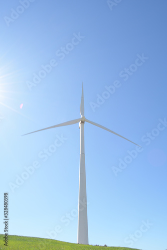 Wind turbine of renewable energy a sunny day photo