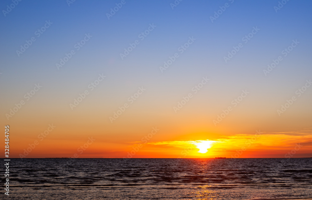 Beautiful sunset at the beach, motion blur wave, with copy space