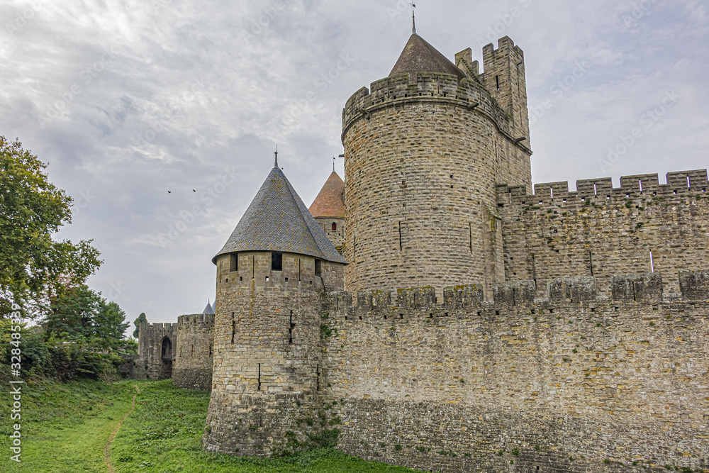 Medieval citadel at Carcassonne - huge and completely over-the-top, encompassing no less than 53 towers, enormous concentric walls, surrounded by a moat. Aude department, region of Occitanie, France.