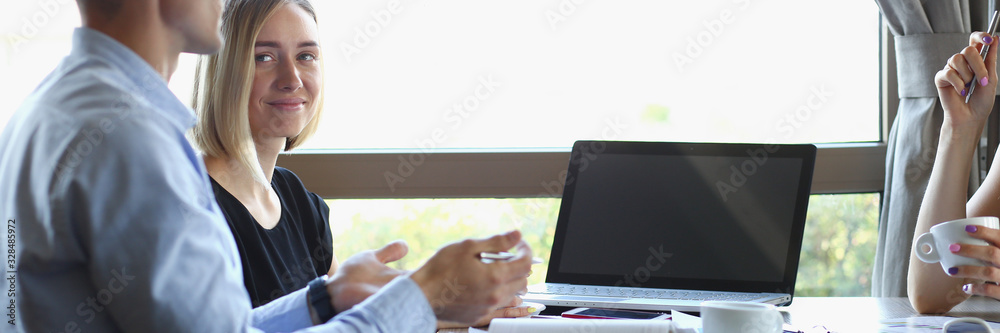 Fototapeta premium Business meeting in a cafe young businessmen