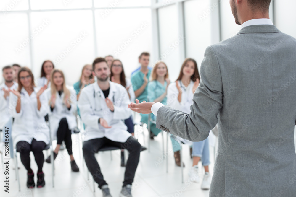 top view. a group of smiling doctors pointing at you. top view. a group of smiling doctors pointing at you.