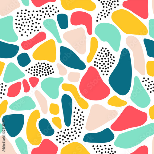 Seamless pattern abstract shapes Terrazzo mosaic style. Repeating collage background pink blue yellow teal fragments. 