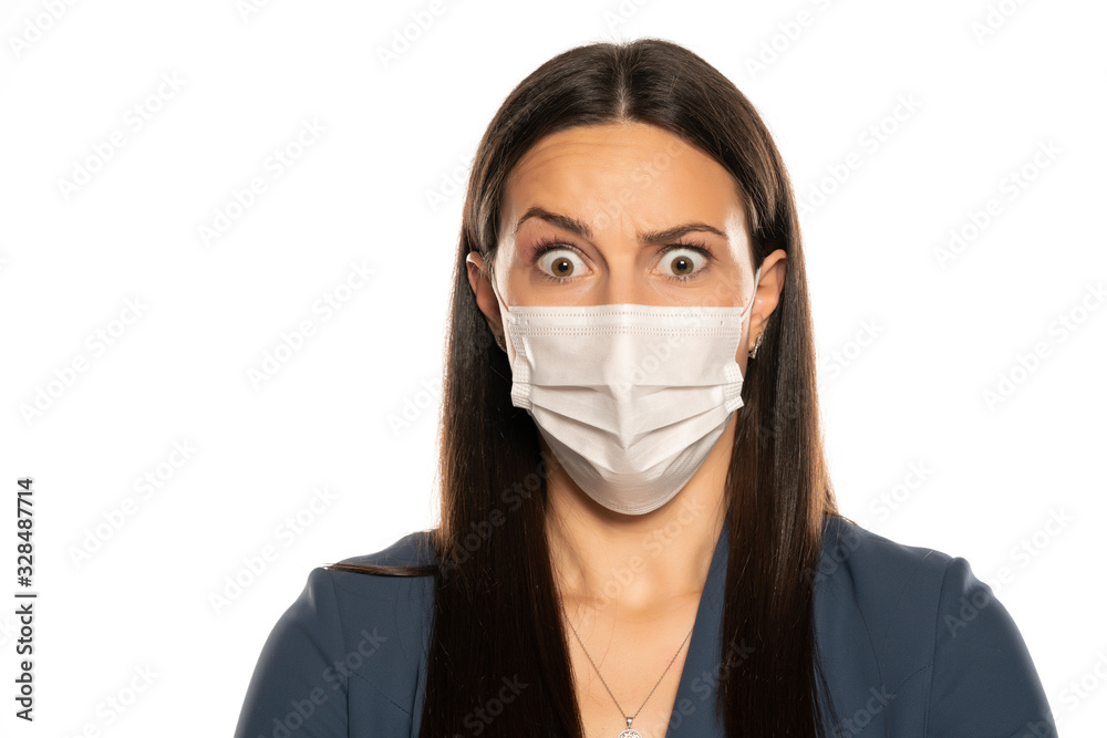Beautiful surprised woman with protective mask on her face Beautiful surprised woman with protective mask on her face