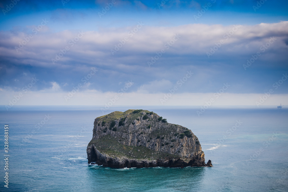 Huge cliffs near the island of Gastelugache. Basque country. Northern spain Huge cliffs near the island of Gastelugache. Basque country. Northern spain