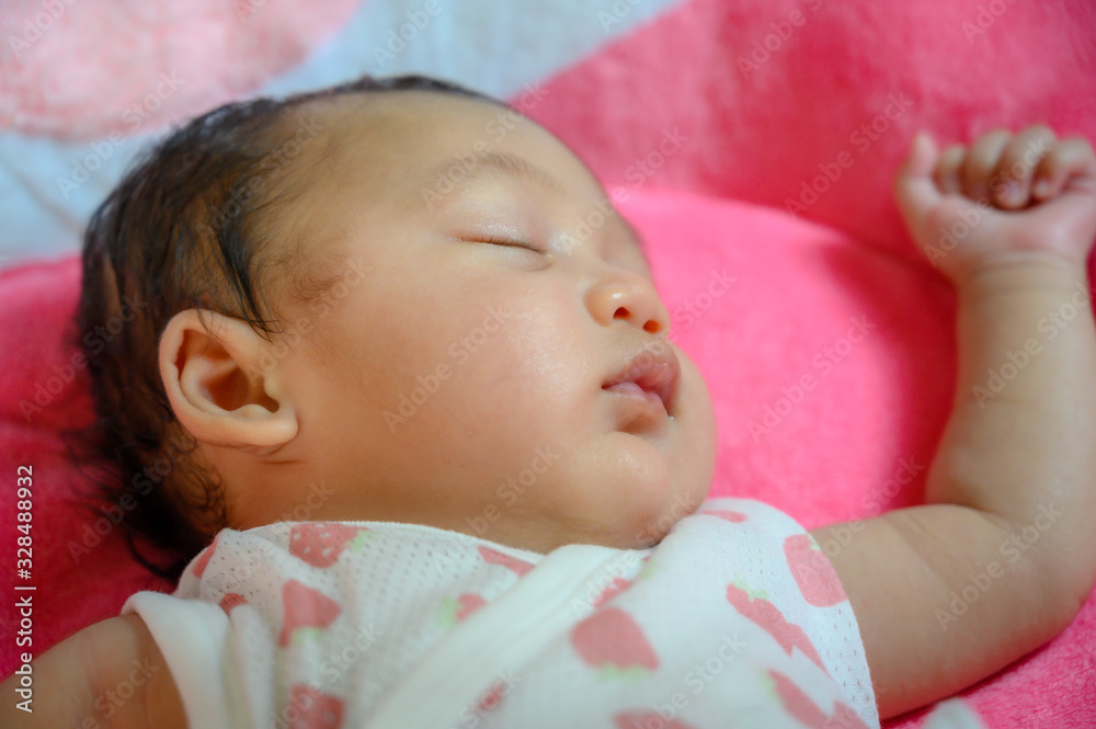 Close up portrait of funny asia female baby on the pink background. Happy asia kid and healthy concept wallpaper. Joy and relaxation. Close up portrait of funny asia female baby on the pink background. Happy asia kid and healthy concept wallpaper. Joy and relaxation.