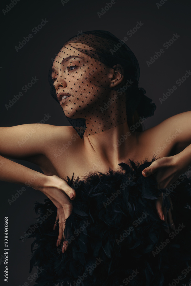 Φωτογραφία fashion portrait of beauty elegant girl posing in black veil on dark background