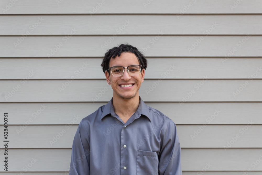Young mixed race millennial male, big happy smile, facing camera, young professional, horizontal aspect Young mixed race millennial male, big happy smile, facing camera, young professional, horizontal aspect