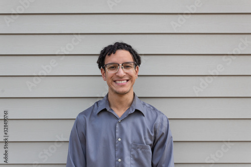 Free Download Young mixed race millennial male, big happy smile, facing camera, young professional, horizontal aspect - GFXLoad
