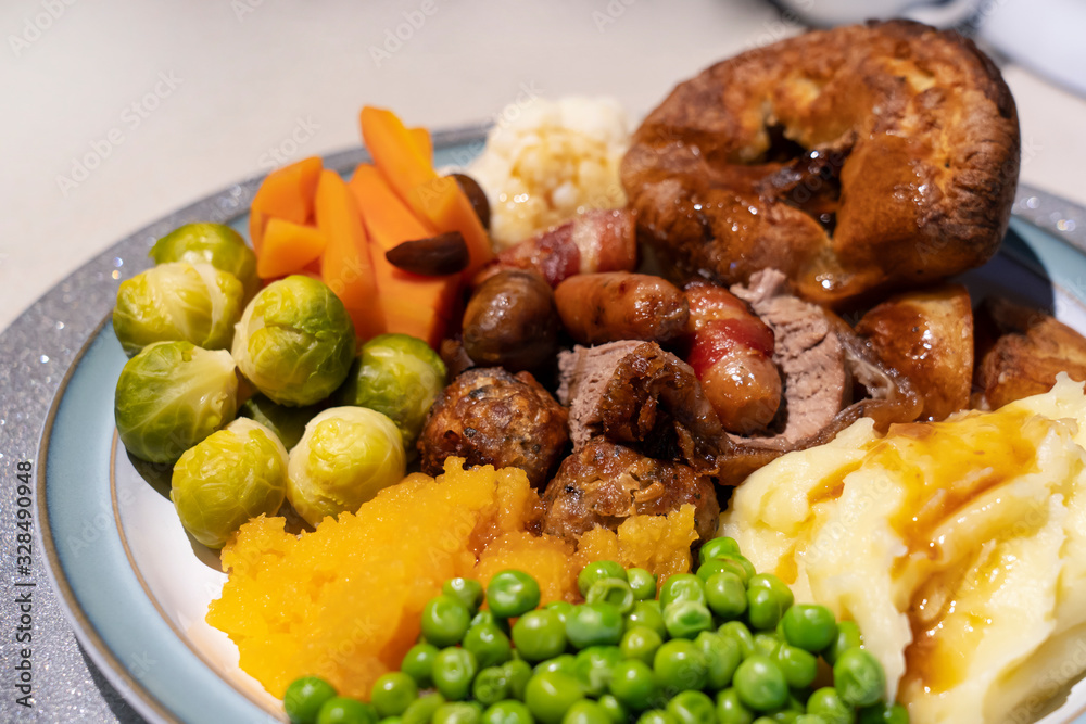 Sunday lunch, homemade roast beef with gravy, mash potato,roast potato,peas and yorkshire pudding,Traditional British dinner,Christmas lunch ideas for party with family or friends Sunday lunch, homemade roast beef with gravy, mash potato,roast potato,peas and yorkshire pudding,Traditional British dinner,Christmas lunch ideas for party with family or friends