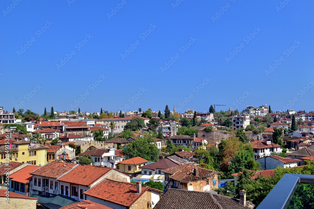  urban landscape on old city of turkish antalya with hot summer day with blue sky