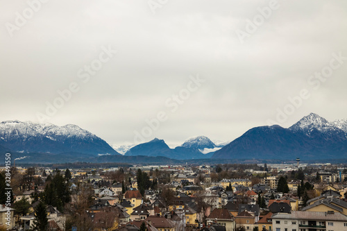 central European city top view moody colors and cloudy weather time Alps mountains scenic background view © Артём Князь