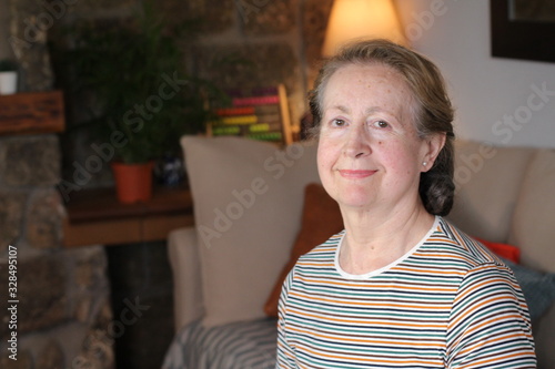 Sixty years old woman at home 