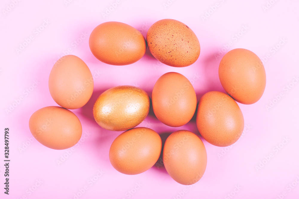 Close up of chicken eggs on plain pastel pink background Close up of chicken eggs on plain pastel pink background