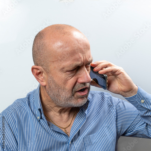 A middle aged man with cell phone
