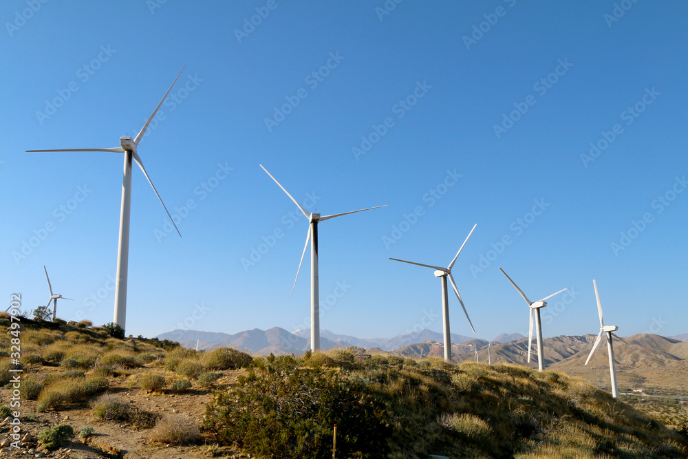 desert mountain crest row wind farm turbines