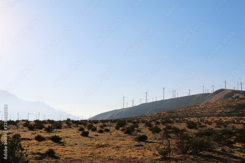 sunset contrast desert mountains ridge wind turbines