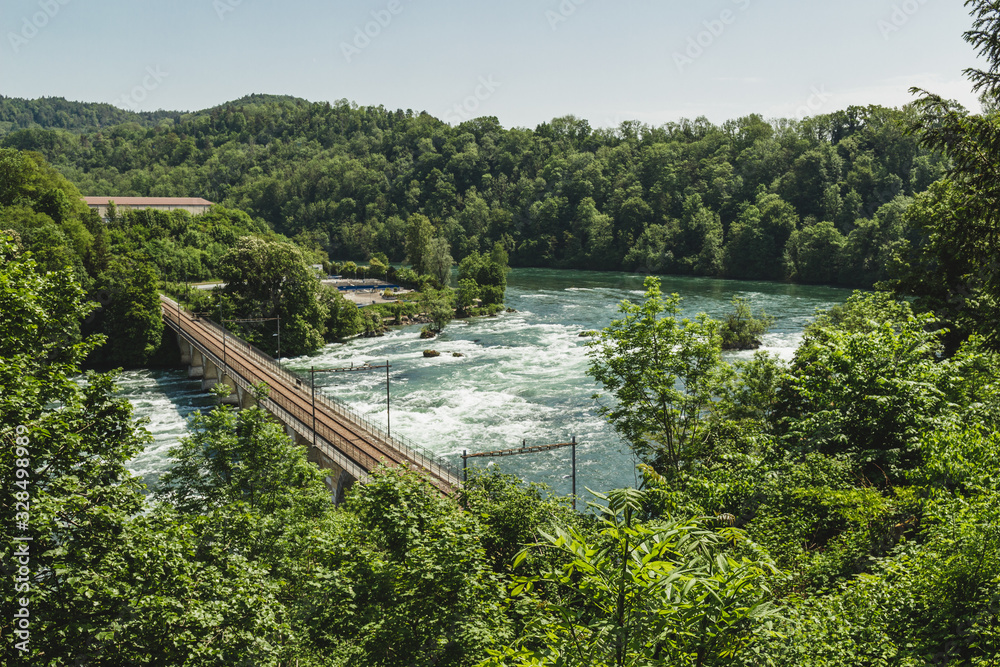 Fototapeta premium Nice landscape of the Rhine Falls, Switzerland. Massif impressive waterfall.