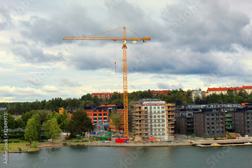Big industrial tower cranes with unfinished