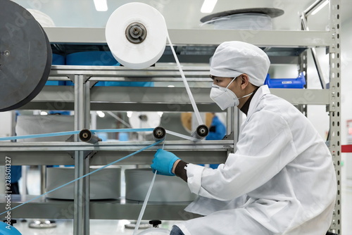 Workers are using polypropylene as a raw material to produce meltblown cloth for medical-surgical masks.COVID-19 Coronavirus outbreak