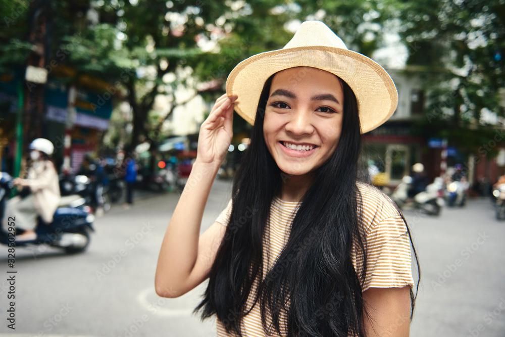 Portrait of young Vietnamese woman in the city