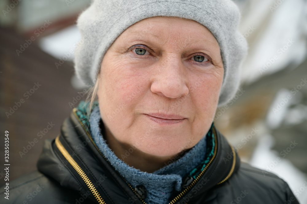 Winter portrait of a beautiful aged woman. Winter portrait of a beautiful aged woman.