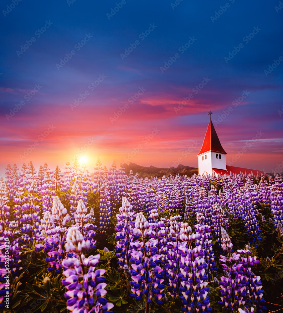Charming view of Vikurkirkja christian church. Location place Vik i Myrdal village, Iceland, Europe.