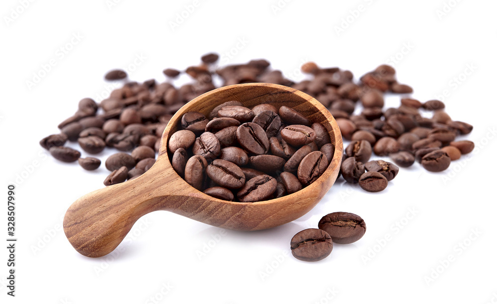 Fototapeta premium Coffee beans in a wooden spoon on white background.