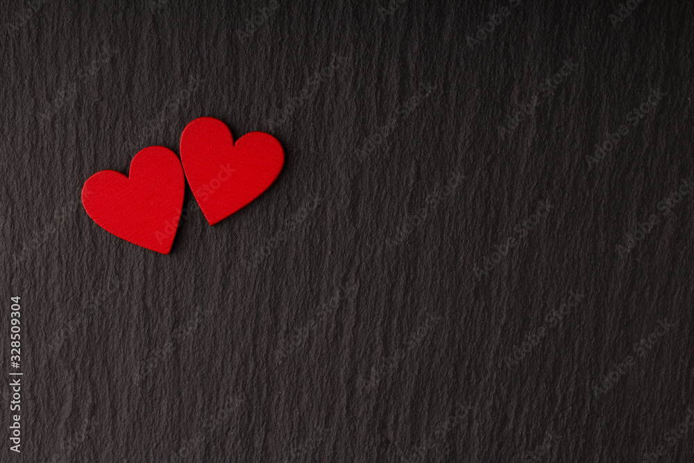 Obraz premium Romantic Love Greeting Card Banner Poster with Copy Space . Two Red Hearts on Dark Stone Background.