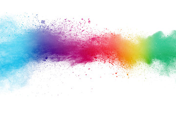 Colorful background of pastel powder explosion.Multi colored dust splash on white background.Painted Holi.