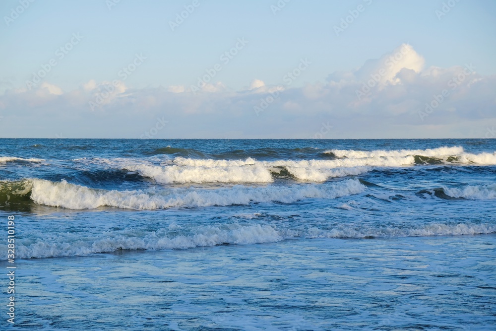 Waves crashing on the breakwater in stormy weather. Baltic Sea coast, Dziwnowek, Poland
