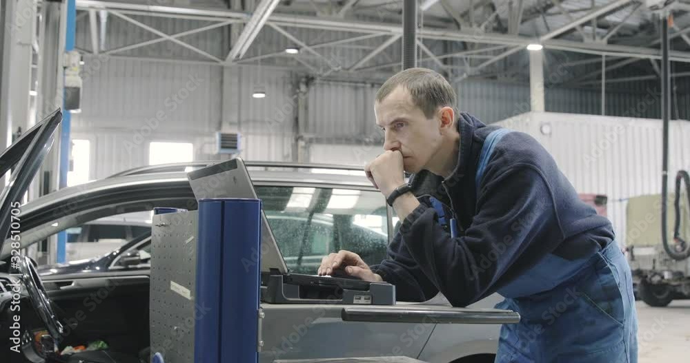 Car Service, Computer Diagnostics: Mechanic Is Looking For Errors In The Car Car Service, Computer Diagnostics: Mechanic Is Looking For Errors In The Car