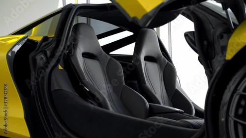 Modern yellow supercar leather seats close up