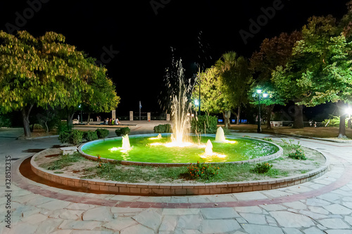 Kallithea, Greece - September 03,2019: Fountain in the center of Kallithea, Greece at night
