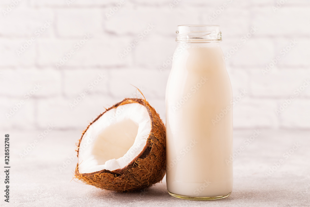 A bottle of coconut milk and coconut A bottle of coconut milk and coconut