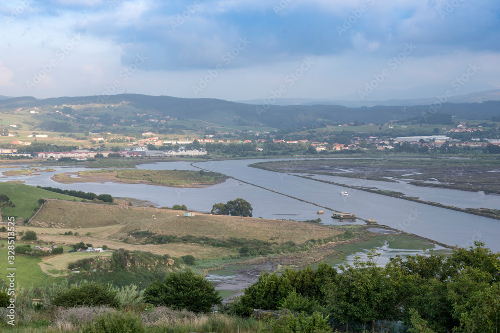 Views of the Saja River, from the west bank, just at the point where it flows into the Ría de San Martín de la Arena, at high tide