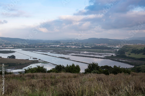 Views of the Saja River, from the west bank, just at the point where it flows into the Ría de San Martín de la Arena, at high tide