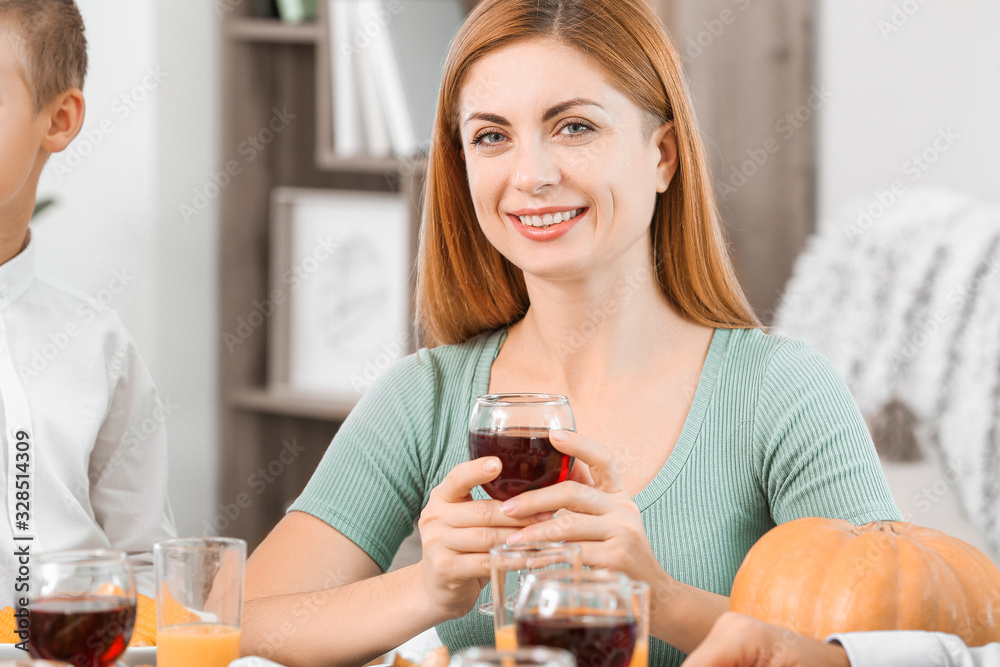Woman with family celebrating Thanksgiving Day at home Woman with family celebrating Thanksgiving Day at home
