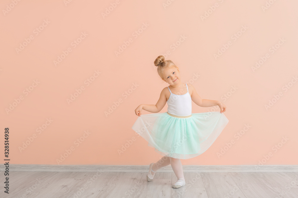 Cute little ballerina near color wall - obrazy, fototapety, plakaty 