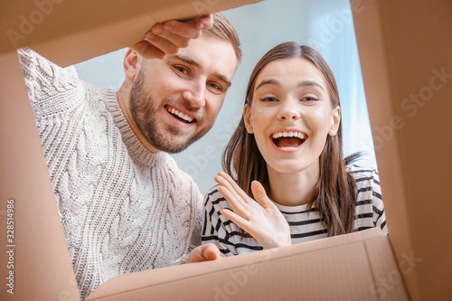 Young couple looking inside...