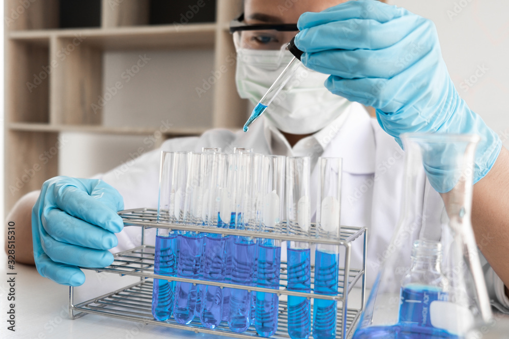 Female scientist are experimenting in the laboratory. Female scientist are experimenting in the laboratory.