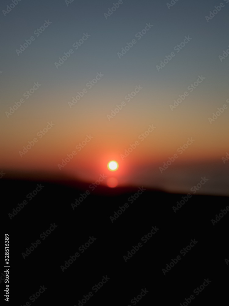 Sunset with a natural sea landscape and a completely clear sky