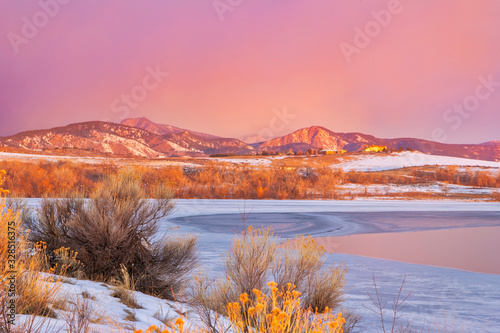 Frozen Colorado Lake at sunrise © rondakimbrow