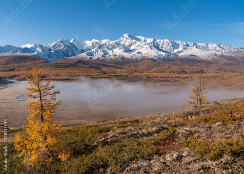 Autumn mountains at sunrise in the fog © kotopalych