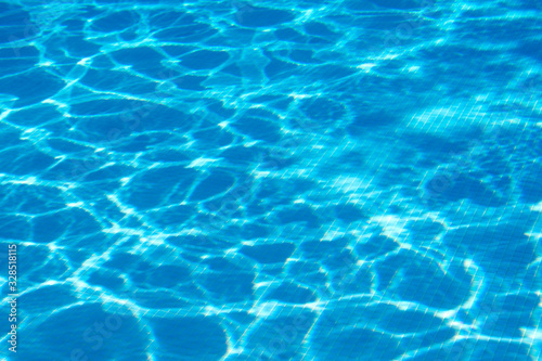 Sun glare at the bottom of the pool. Fragment pool background