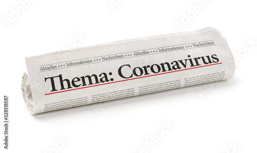 Zeitungsrolle mit der Überschrift Coronavirus photo