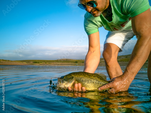 Fototapeta Naklejka Na Ścianę i Meble -  Bass Fishing on lake