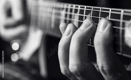  fingers on fretboard electric guitar